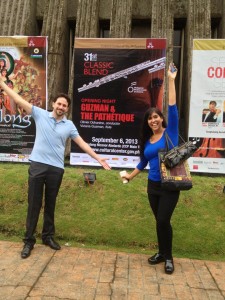 Olivier Ochanine & Viviana Guzman in front of Concert Poster